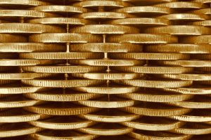 Stacks of interlinked golden coins.