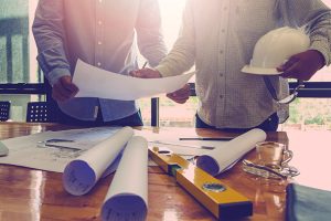 Two people looking at plans