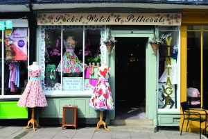 St Edmunds UK small old shop displaying vintage clothes