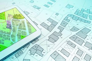 Street plans with tablet shutterstock_2266106503 Francesco Scatena
