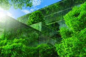 Green building glass surrounded by trees shutterstock_1996959128 Fahroni