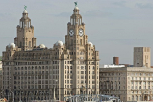 Royal Liver Building on a cloudy day. The image shows the clock on the iconic building and the Liver bird.