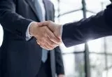 A picture showing two businessmen shaking hands
