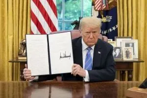 President Trump with signed executive order