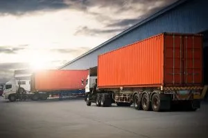 Lorries-by-warehouse-shutterstock_2341519529-Siwakorn-1933-300x200.webp