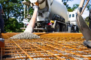 Cement-mixer-pouring-concrete-shutterstock_2496414829-1-photoschmidt-300x200.webp