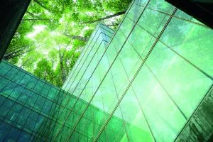 Green-office-building-and-trees-shutterstock_2521421215-Fahroni-300x200.webp